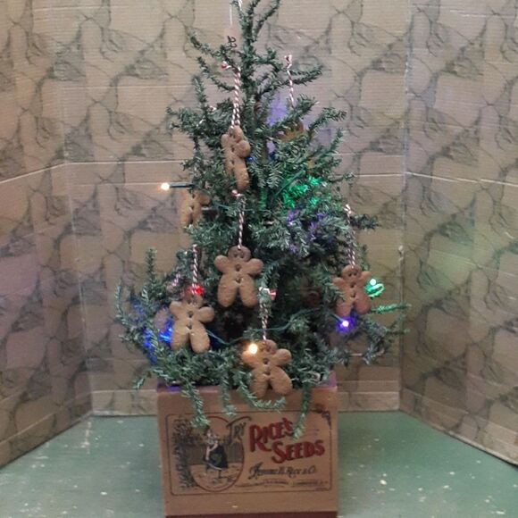 Gingerbread tree with lots of gingerbread cookie ornaments and colored lights - Picture 1 of 6